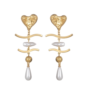 Elegant gold heart earrings with white pearls and long tassel drop in vintage style
