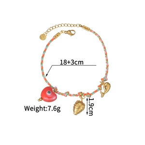Detail view of woven bracelet showing S.Steel clasp, strawberry heart dolphin charms