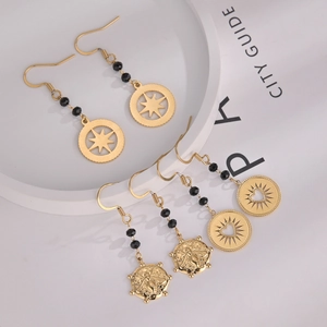 Detailed set of 14K gold plated earrings with black beads and celestial star pendants
