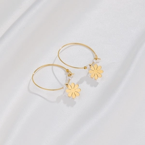 Minimalist 14K gold-plated hoop earrings featuring daisy pendants and small white beads