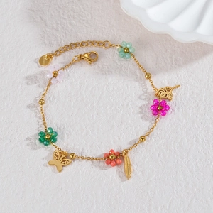 Bracelet en acier inoxydable doré 18 carats avec fleurs colorées et étoiles