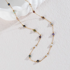 Handmade bohemian beaded necklace with colorful faceted stones and gold chain