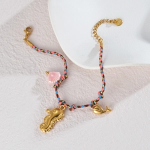 Marine themed braided necklace with seahorse, whale, and shell charms for women