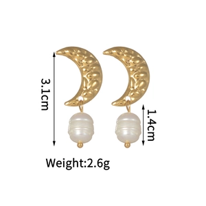 Detail shot of vintage baroque pearl earrings with golden crescent moon and size dimensions