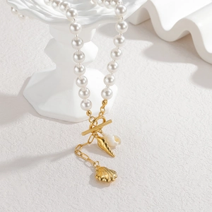 Elegant pearl necklace featuring golden seashell charms and OT buckle on white display