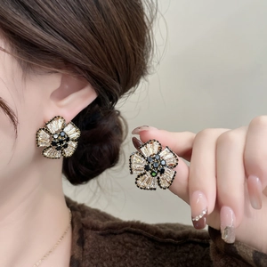 Elegant 3D flower stud earrings with baguette-cut zircons and black center gems