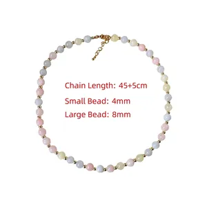 Detail of beaded necklace showing 4mm and 8mm colored beads with lobster clasp closure