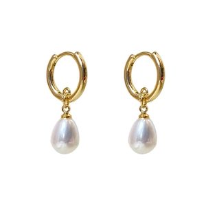 Elegant gold hoop earrings featuring polished finish and white teardrop pearl pendants