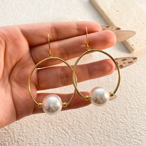 Vintage style 18K gold plated hoop earrings featuring a large white pearl drop