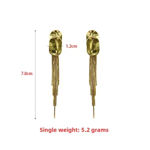 Detailed size view of gold long tassel earrings measuring 7.8cm in length and 1.2cm in width
