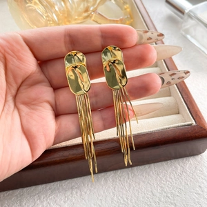 Elegant gold long tassel dangle earrings with layered oval metal pieces for women
