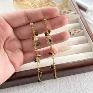 Elegant gold-plated tassel earrings featuring tiger eye beads and sparkling zircons