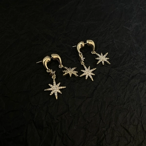 Elegant gold plated eight-pointed star stud earrings with sparkling cubic zirconia stones