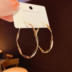 Classic gold twisted hoop earrings with irregular texture and S925 silver needles