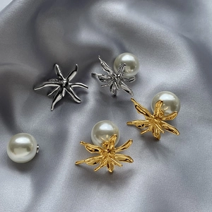 Exaggerated geometric flower metal earrings with large pearl backings in gold and silver