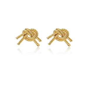 Detailed macro view of 14K gold-plated brass knot earrings with polished spiral texture