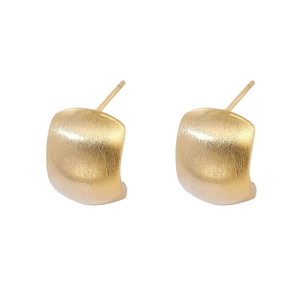 Minimalist brushed gold earrings with a modern curved surface and matte metallic finish