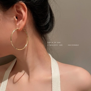 Polished large gold geometric hoop earrings for women with high-gloss metallic finish