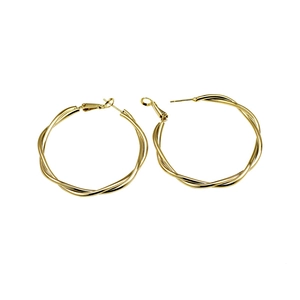 Polished gold twisted hoop earrings with a large circular woven design for women