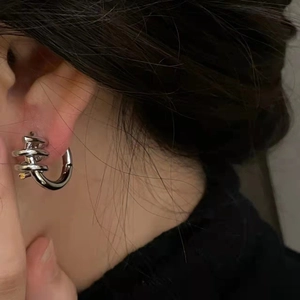 Modern silver spiral metal hoop earrings with a minimalist geometric screw design for women