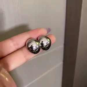 Polished silver half-moon teardrop earrings with a mirror finish for women