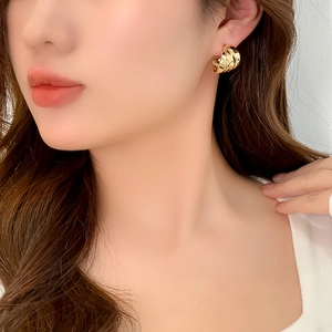 Polished 14K gold-plated chunky twisted hoop earrings for a stylish layered metal look