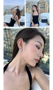 Detailed close-up of sparkling zircon butterfly earrings with elegant silver butterfly design