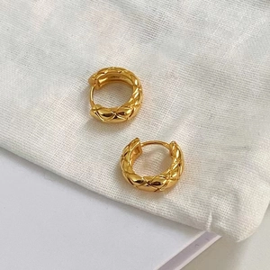 Vintage golden quilted hoop earrings with textured diamond pattern for women