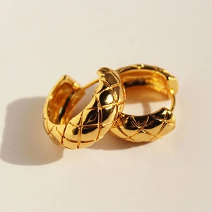 Elegant gold quilted diamond pattern hoop earrings with a secure clasp closure
