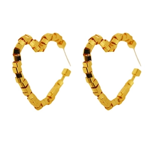 Golden heart stud earrings with geometric faceted square beads on white background