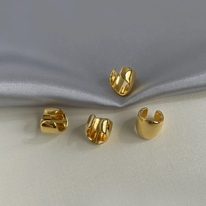 Retro golden metal ear cuffs in a 4-piece set with a minimalist polished C-shape design
