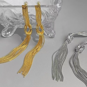 Elegant gold and silver long chain knot tassel drop earrings with metallic finish
