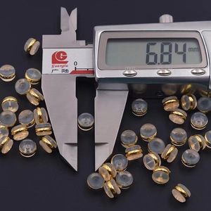 Gold-plated silicone earring backs measuring 6.84mm for securing stud earrings