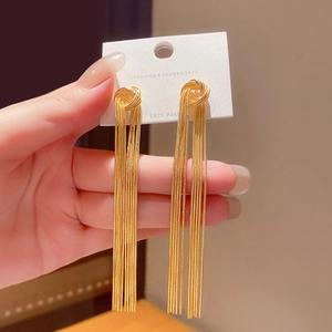 Detailed close-up of golden tassel drop earrings featuring S925 silver needles