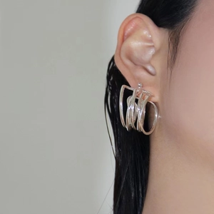 Chic silver multi-layer layered metal hoop earrings with a modern industrial minimalist style