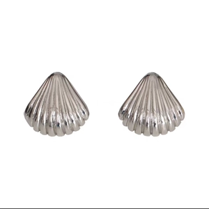 Polished silver shell stud earrings in 18K plated metal with striped texture on white background