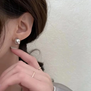 Polished silver spherical stud earrings with a minimalist C-shape vintage design for women