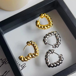 French vintage style twisted heart hoop earrings in polished gold and silver finish