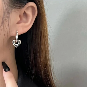 S925 silver plated heart pendant hoop earrings shown on model in a minimalist style