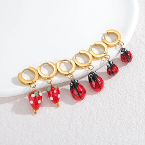 Chic stainless steel strawberry and ladybug drop earrings in a gold-plated hoop set