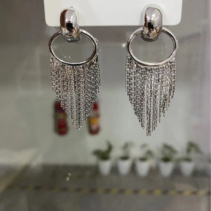 Elegant silver tassel earrings with geometric oval loops and long metal chain drapes