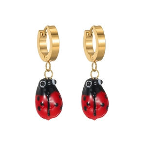 Vintage gold ladybug earrings with red enamel beetle charms on minimalist round hoops