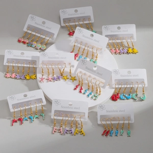 Colorful ocean series earrings featuring dolphin octopus and starfish in gold finish