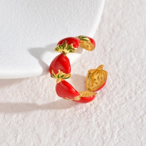 Golden stainless steel open ring featuring red enamel strawberry charms with green leaves