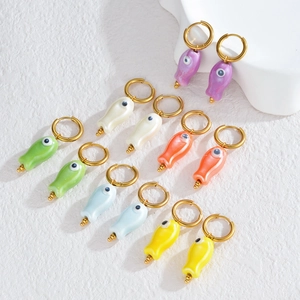 Colorful ceramic fish drop earrings with evil eye detail on gold stainless steel hoops