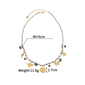Detail view of woven cord necklace with stainless steel heart and palm tree charms
