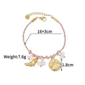 Detailed view of woven 18K gold bracelet with moon charm and white mineral beads
