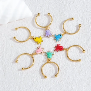 Detail of octopus charm earrings in multiple enamel colors with seaside shell decoration