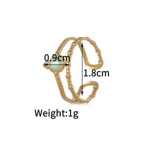 Detail view of gold stainless steel ring with 0.9cm green stone and size measurements