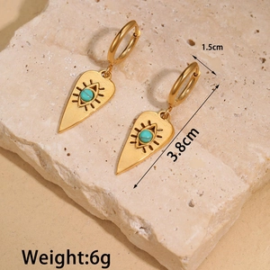 Macro view of vintage gold evil eye earrings with turquoise beads and size dimensions